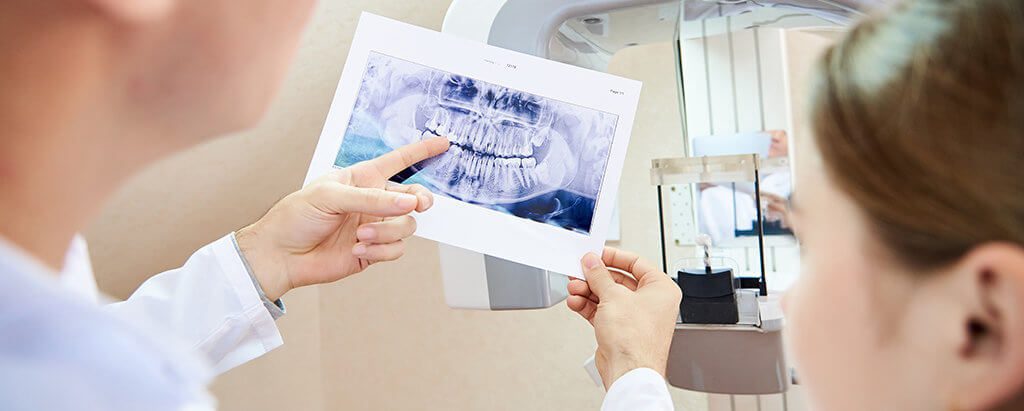 endodontists examing digital xrays