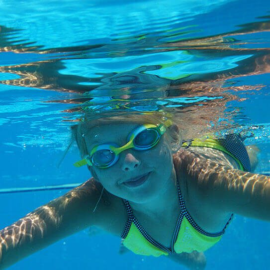 young girl swimming